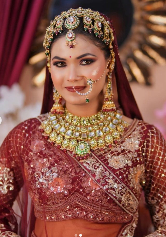 Dramatic close-up bridal portrait with statement kundan jewellery, styled for pre-wedding photography